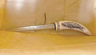 image of a letter-opener knife with 20cm blade and bone-like handle with blue etching of a whale