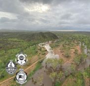 Six people were airlifted from rising flood waters west of Alice Springs 