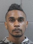 Keenan Mitchell, 23 was handcuffed when he escaped police custody in Alice Springs yesterday.